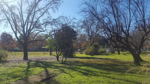 a park with trees and green grass and a field at Hotel Agustin Garcia in Tigre