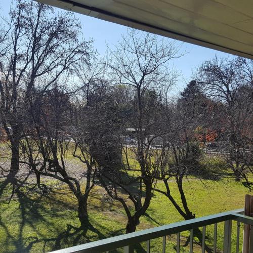 a view of a field from a porch with trees at Hotel Agustin Garcia in Tigre