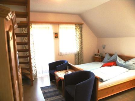 מיטה או מיטות בחדר ב-Gästehaus Lisa