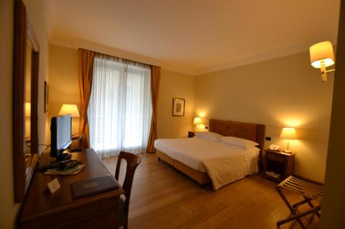 Postel nebo postele na pokoji v ubytování Katane Palace Hotel