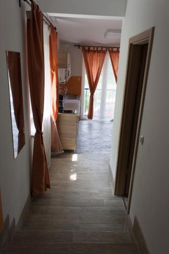 a hallway of a room with curtains and a kitchen at Haus Bierherr in Mariazell
