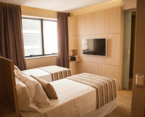 
Cama ou camas em um quarto em Ritz Copacabana Boutique Hotel
