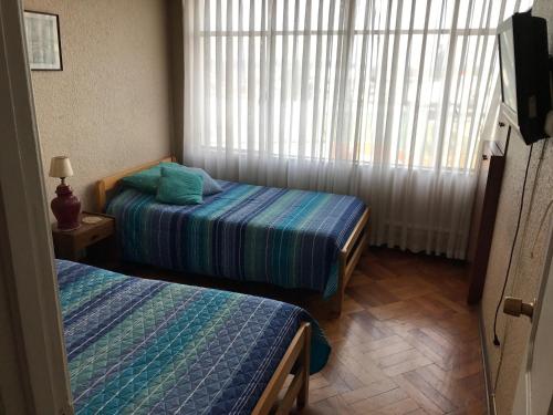 Кровать или кровати в номере Departamento VPR 560 Valdivia