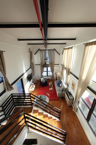 an aerial view of a living room with a couch at The Box House Hotel in Brooklyn