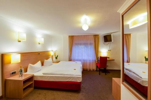 מיטה או מיטות בחדר ב-Hotel Fährhaus Ziehl