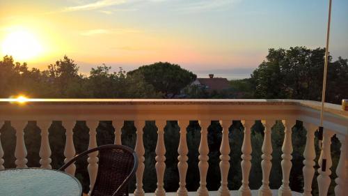 a view from the balcony at sunset at Apartment Poleti in Malinska