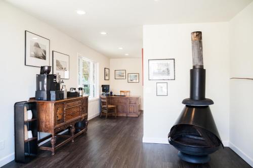 a living room with a wood stove in it at The Landing at Morro Bay in Morro Bay