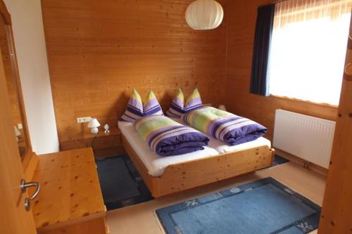 a room with a couch with pillows on it at Haus Schneeflocke in Lech am Arlberg