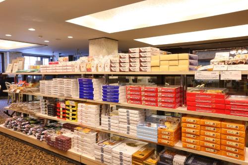 a store filled with lots of boxes on shelves at Hotel Japan Shiga in Yamanouchi
