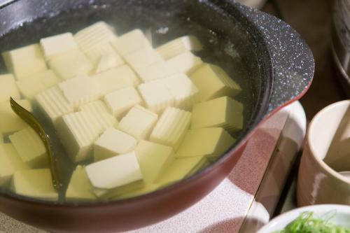 a pot of food with butter in it at Tokushima Grandvrio Hotel in Tokushima