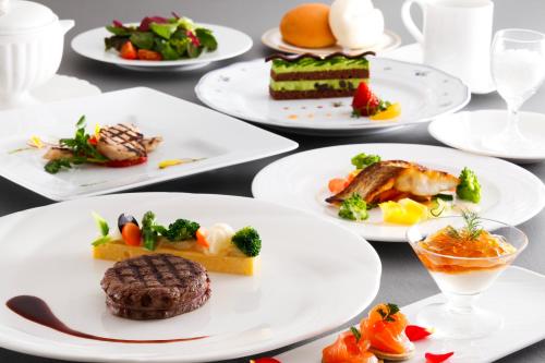a group of plates of food on a table at Tokushima Grandvrio Hotel in Tokushima