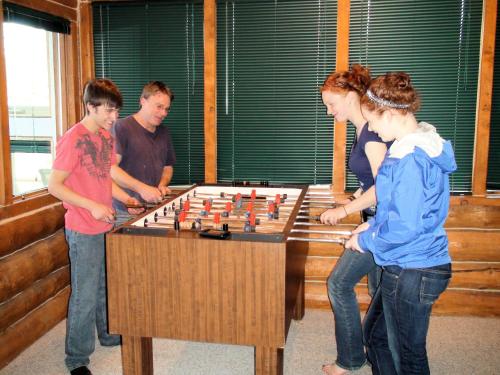 a group of people playing a game of chess at Bear Den Vacation Home in Anchor Point