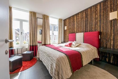 Ένα ή περισσότερα κρεβάτια σε δωμάτιο στο Guesthouse De Roode