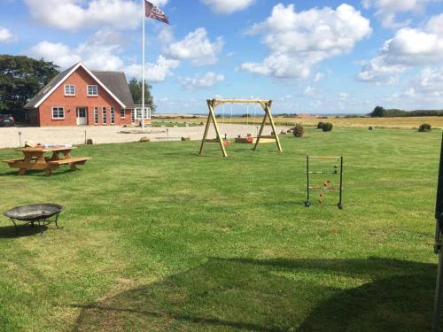 an empty playground with a picnic table and a swing at Bed and Breakfast Lemvig in Lemvig