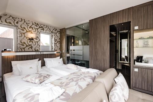 Un ou plusieurs lits dans un hébergement de l'établissement Hotel Kolb
