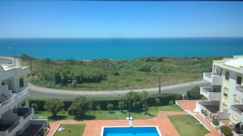 a view of the ocean from a building at Ericeira penthouse with total sea view in Ericeira