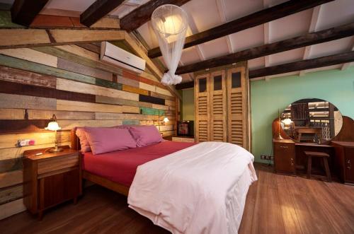 Ein Bett oder Betten in einem Zimmer der Unterkunft You Le Yuen