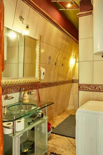 a bathroom with a sink and a mirror at Dali Apartments in Skopje