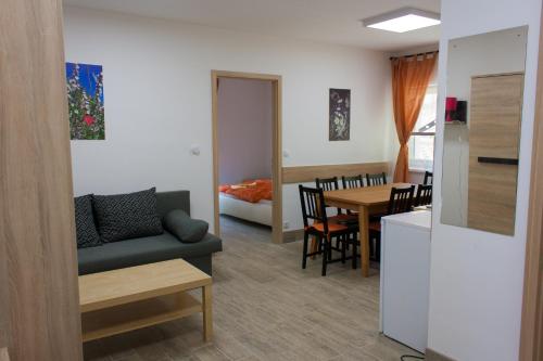 a living room with a couch and a table at Haus Bierherr in Mariazell