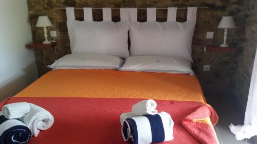 a bedroom with a bed with towels on it at IL PRINCIPINO B&B in Massa