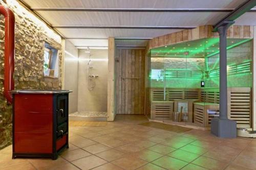 a large bathroom with a shower and a sink at Gaestehaus Herzig in Oberrimsingen