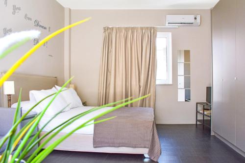 Ένα ή περισσότερα κρεβάτια σε δωμάτιο στο Athens Connection Apartments
