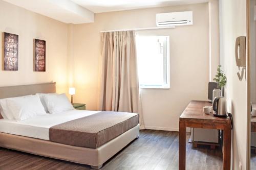 Ένα ή περισσότερα κρεβάτια σε δωμάτιο στο Athens Connection Apartments
