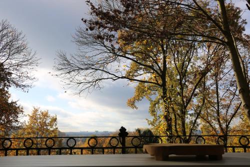 a park bench in front of a fence at Trumpet House in Leuven