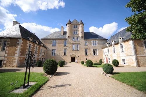 a large stone building with a tower on top of it at Château d'Avanton in Avanton