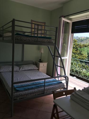 Un pat sau paturi într-o cameră la Agriturismo Valdolivo