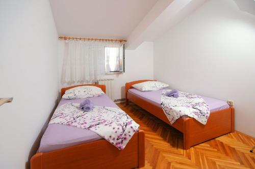 Cama o camas de una habitación en Apartments Daniela