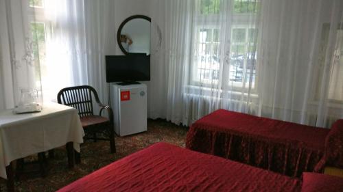 Postel nebo postele na pokoji v ubytování Hotel Tantzi