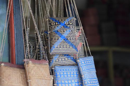 a group of blue and white bags are hanging at Mu Homestay in Tetebatu