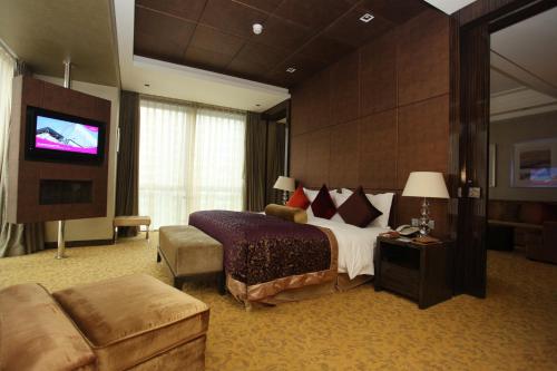 a hotel room with a bed and a flat screen tv at Crowne Plaza Beijing Chaoyang U-Town by IHG - within 30 minutes to Forbidden City by metro in Beijing