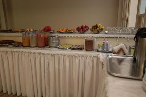 a white table with food on top of it at Hotel Presidente Ipatinga in Ipatinga