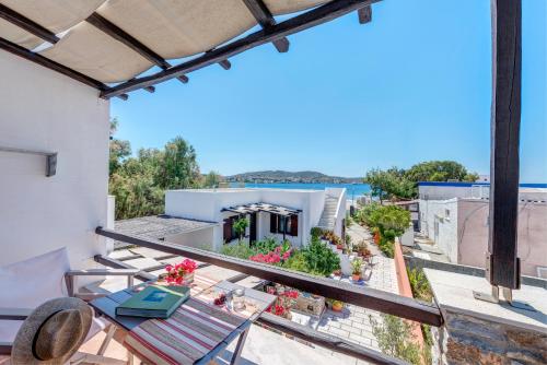 a balcony with a view of a house at Anemologio in Finikas