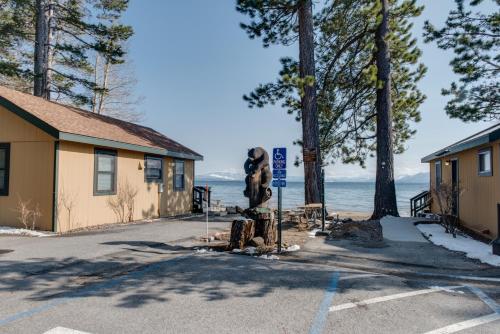 a parking lot with a statue of a bear next to a building at Franciscan Lodge in Tahoe Vista