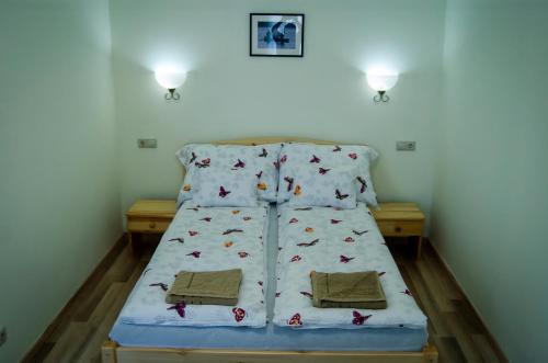 Krevet ili kreveti u jedinici u okviru objekta CSONGRÁDI VENDÉGVÁRÓ Apartmanok, Szarka ház