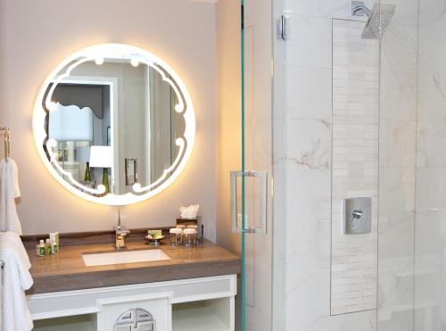 a bathroom with a mirror and a sink at Morrison Clark Inn in Washington, D.C.