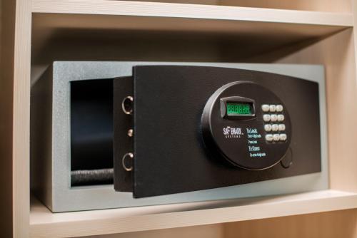 a microwave oven sitting on top of a shelf at Blue Horizon Hotel in Vancouver