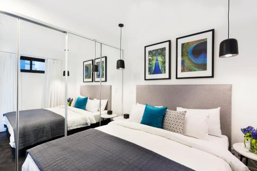 Giường trong phòng chung tại Botanik Apartment Hotel