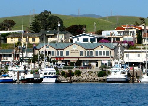 a group of boats are docked in a harbor at Front Street Inn and Spa in Morro Bay