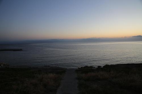 a view of a body of water with a path at Kasgar Court Hotel in Karaoğlanoğlu