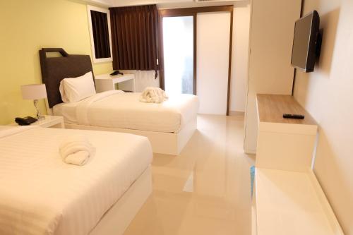Ένα ή περισσότερα κρεβάτια σε δωμάτιο στο Sunny Residence