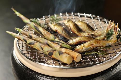 a plate of food with a bunch ofcooked food at Hakkei in Maniwa