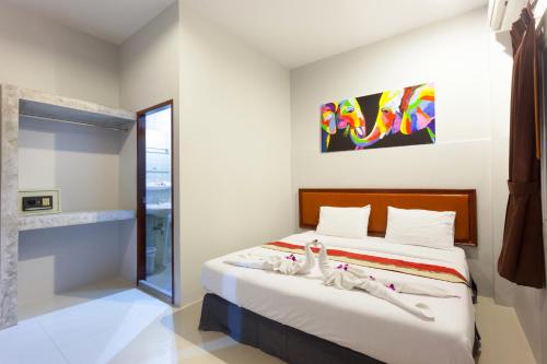 Ένα ή περισσότερα κρεβάτια σε δωμάτιο στο Freedom Hotel