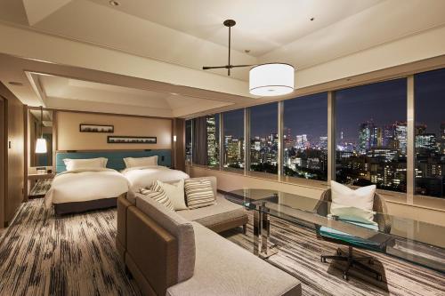 a bedroom with a bed and a view of a city at The Prince Park Tower Tokyo - Preferred Hotels & Resorts, LVX Collection in Tokyo