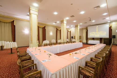 a large banquet hall with tables and chairs in it at Legacy Ottoman Hotel Istanbul Old City in Istanbul