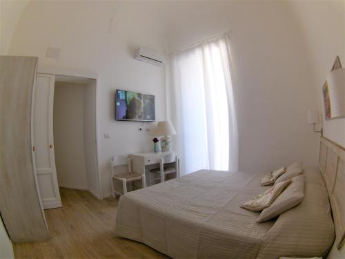 TV a/nebo společenská místnost v ubytování Duomo Sant'Agata Apartments