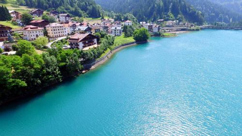 an aerial view of a town next to a river at Albergo Meublè Victoria in Auronzo di Cadore